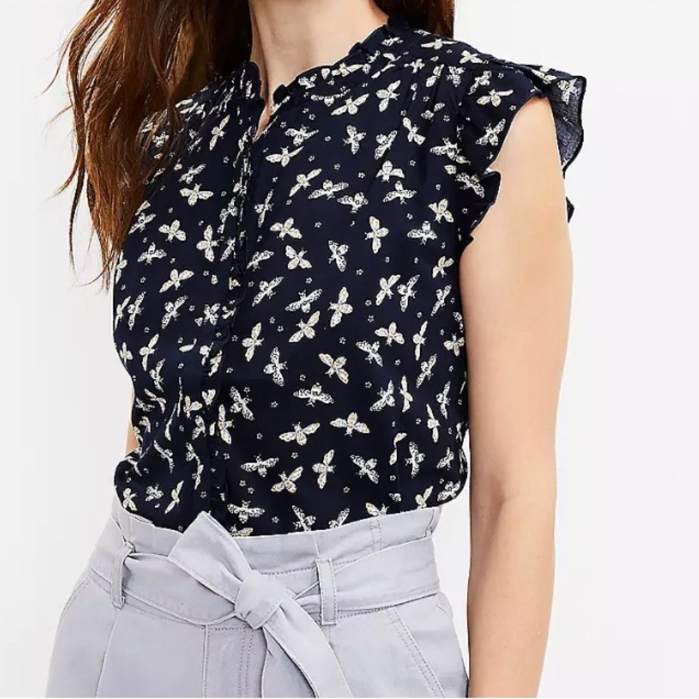 Sleeveless button up blouse